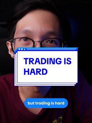 A man with glasses stares at the camera, with a graphic overlay depicting a computer window. The text in the overlay reads 'TRADING IS HARD', with a smaller text at the bottom that says 'but trading is hard'. The background is dark, with subtle lighting.