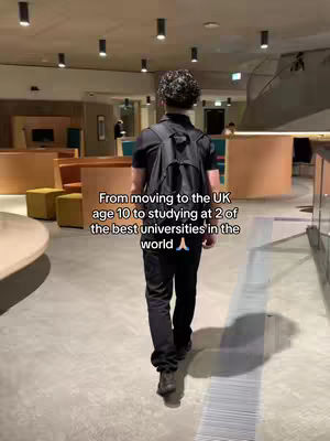 The image shows a person walking away from the camera in a well-lit, modern interior space. The person is wearing a black top, black pants, and a backpack. The background features soft lighting, wooden accents, and a curved countertop. Text overlayed on the image describes the subject's journey.