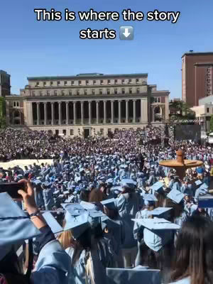 A crowd of people in graduation gowns and caps, mainly in shades of blue, are gathered in front of a large, imposing building with many columns. The sky is clear and blue. Text is overlaid on the image.