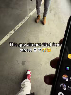 The cover image captures a first-person perspective. In the foreground, a hand holds a phone, the screen displaying a messaging app. The phone partially obscures the view. In the mid-ground, a person wearing a shoe with red and white colors is walking. In the background, another person is seen from the waist down, sporting light pants and tan boots, standing on a gray concrete surface.