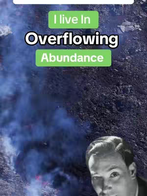 The cover image features a split composition. The top half displays a natural background with heavy smoke or fog and a blackish ground. The bottom part is a grayscale portrait of a man with slicked-back hair. In the center, there are bright green rectangular text boxes with the words "I live In" and "Overflowing Abundance" in white bold font.