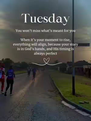 The image is a vertical composition featuring a road with runners in the background. Text is overlaid on the image, with the word 'Tuesday' at the top in a large, elegant font. Below, a longer text outlines a motivational message. The road is flanked by green vegetation and a utility pole. The overall color palette is soft and desaturated, with a warm gradient sky, suggesting a sunrise or sunset.
