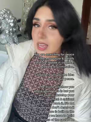 A woman with long dark hair, wearing a patterned top and a white jacket, is looking directly at the camera and speaking. Text overlays on the image provide the video's message.