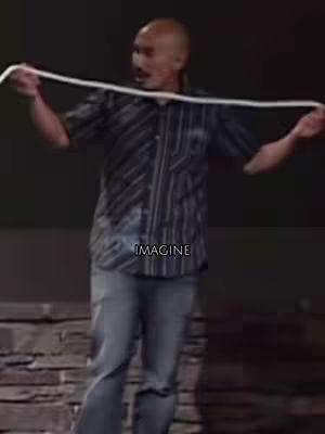 A man holding a white rope with the word "IMAGINE" overlaid on the image.