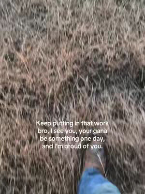 The cover image shows a close-up shot of someone's feet walking through tall, dry grass and brush. The lower part of the legs and a brown boot are visible against a backdrop of brown and tan vegetation. Text overlay at the center describes inspirational message.