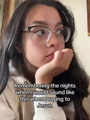 A young woman with long dark hair, wearing glasses, and a cream-colored sweater is looking off to the side with a pensive expression, hand to her mouth, with text overlayed on the image.