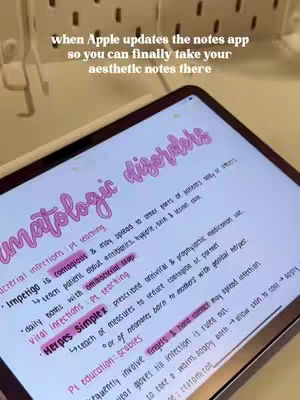 An iPad sits on a desk, its screen displaying handwritten notes about dermatologic disorders. The notes are in pink ink and appear neet and aesthetic.