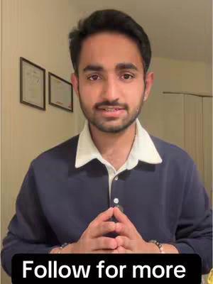A medium shot shows a light-skinned man with short, dark hair and a neatly trimmed beard, wearing a blue collared longsleeve shirt with a white trim around the collar. He is positioned in front of a beige-colored wall with two framed pictures visible behind him. His hands are clasped together in front of his chest, and a black bar with the text 'Follow for more' covers the bottom of the image.