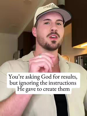 A man in a white shirt and a baseball cap is looking at the camera. Text overlay on the image.