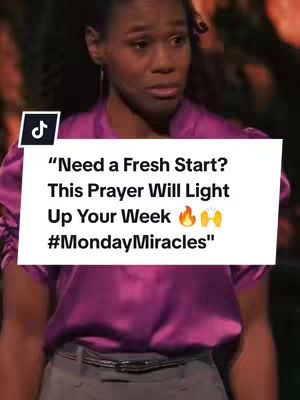 A woman with dark hair and a serious expression is the focal point of a vertical video cover. She is wearing a deep pink satin-like top, and a white rectangle overlay with the words "Need a Fresh Start? This Prayer Will Light Up Your Week" appears in the center, with a flame and weightlifting emoji near the text. The words "#MondayMiracles" are below this text in bold lettering, over a blurred background.