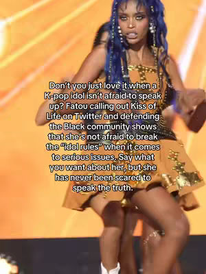 A woman with blue hair takes center stage, dressed in a short, patterned dress with gold embellishments. The background is a blurry orange. Text overlays the image.