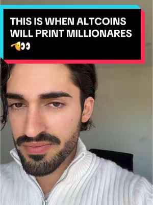 A close-up of a man with dark hair and a beard. He is wearing a white sweater and is looking at the camera. A text overlay in a black rectangle is at the top of the image.