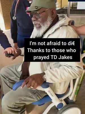 Bishop TD Jakes sits in a chair with wheels, supported by others. The background appears to be a hallway or outdoor area. A text overlay with the words 'I'm not afraid to die' and 'Thanks to those who prayed TD Jakes' is present.