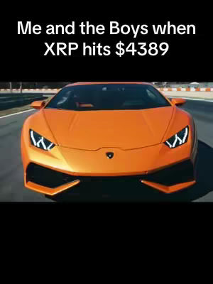An orange Lamborghini sports car is shown head-on, taking up most of the frame. The background is a blurred view of trees and a road, suggesting motion. Text overlay at the top reads: 'Me and the Boys when XRP hits $4389'.