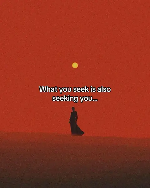 An image with a vibrant red background resembling a sunset. In the center, a silhouetted figure of a person in a long flowing dress or robe is seen walking towards the left. Above them, a yellow circle suggests the sun or moon. Text overlayed on the image reads: 'What you seek is also seeking you...' The overall aesthetic conveys a sense of mystery and spirituality.