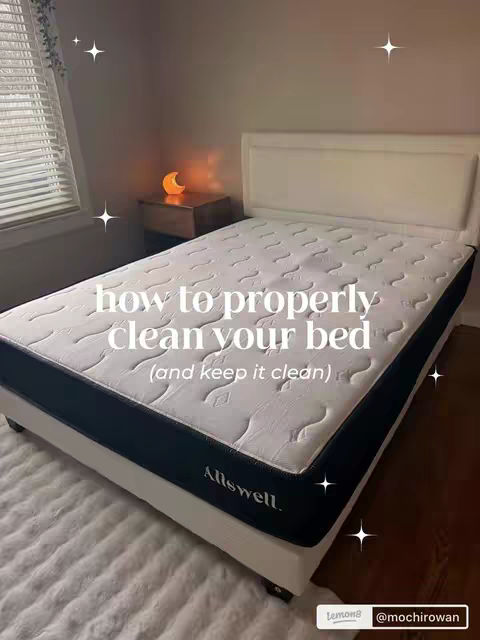 The image showcases a cleanly made bed in a bedroom setting. The bed is the focal point, featuring a white headboard and a mattress with a quilted pattern. The room has a neutral color scheme, with a window on the left side allowing natural light to enter. On a bedside table, there is a lamp with a soft, warm glow. Decorative stars are scattered around the image, framing the text overlay. The overall composition is well-lit with a focus on cleanliness and comfort.