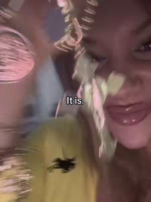 The cover image is a selfie style shot featuring a person zoomed in. The person has their lips close to the camera, and an added text overlay that says 'It is.' in white text on the bottom of the screen. The image has an out of focus appearance where a yellow and pink color palette is noticed