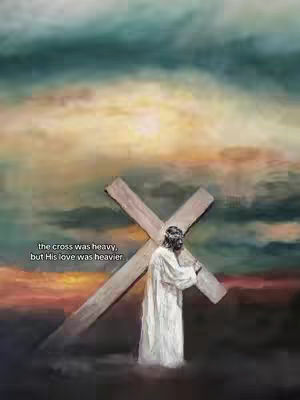 An artistic depiction of Jesus carrying the cross. Jesus is seen from the back, wearing a white robe and a crown of thorns, carrying a large wooden cross on his shoulder. The background features a blend of colors suggesting a sunset or sunrise with hues of orange, yellow, and blue, creating a dramatic and ethereal atmosphere. Text overlayed to the bottom left reads: 'the cross was heavy, but His love was heavier'.