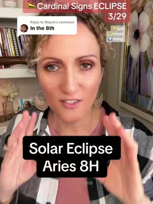 A woman with light skin and reddish-brown hair smiles at the camera. The top half of her body is visible, with a black and white checkered shirt and a pink shirt underneath. The background includes indoor shelves with books and decorative items. The main text overlay says 'Solar Eclipse Aries 8H'.