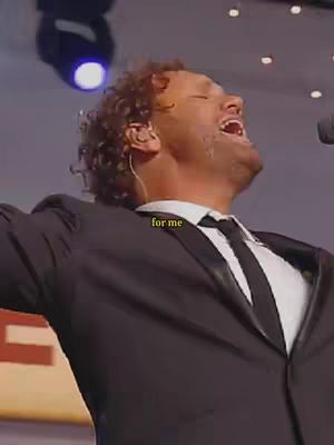 The cover image shows a man singing with passion, his head tilted back and mouth open. He is wearing a suit with a white shirt and black tie. The background is slightly blurred, suggesting a performance setting. The text overlay at the image bottom right says "for me".