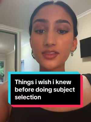 A selfie-style shot of a young woman, framed from the chest up. She is centered and looking directly at the camera with a neutral expression. She is wearing a black top. A text box at the bottom of the frame contains the video's hook. The background is soft, with the suggestion of an interior space.