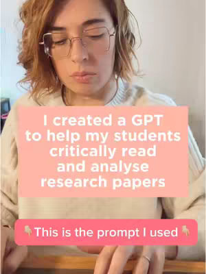 A woman with short, wavy blonde hair and glasses is looking down with a serious expression, text overlays appear in a light pink box. The image has muted lighting.