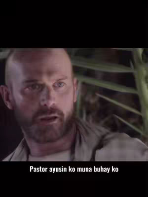 A man with a short beard and shaved head looks at the camera with a concerned expression. Text at the bottom suggests a conversation about self-improvement within a religious context. The background is blurred, suggesting an outdoor setting.