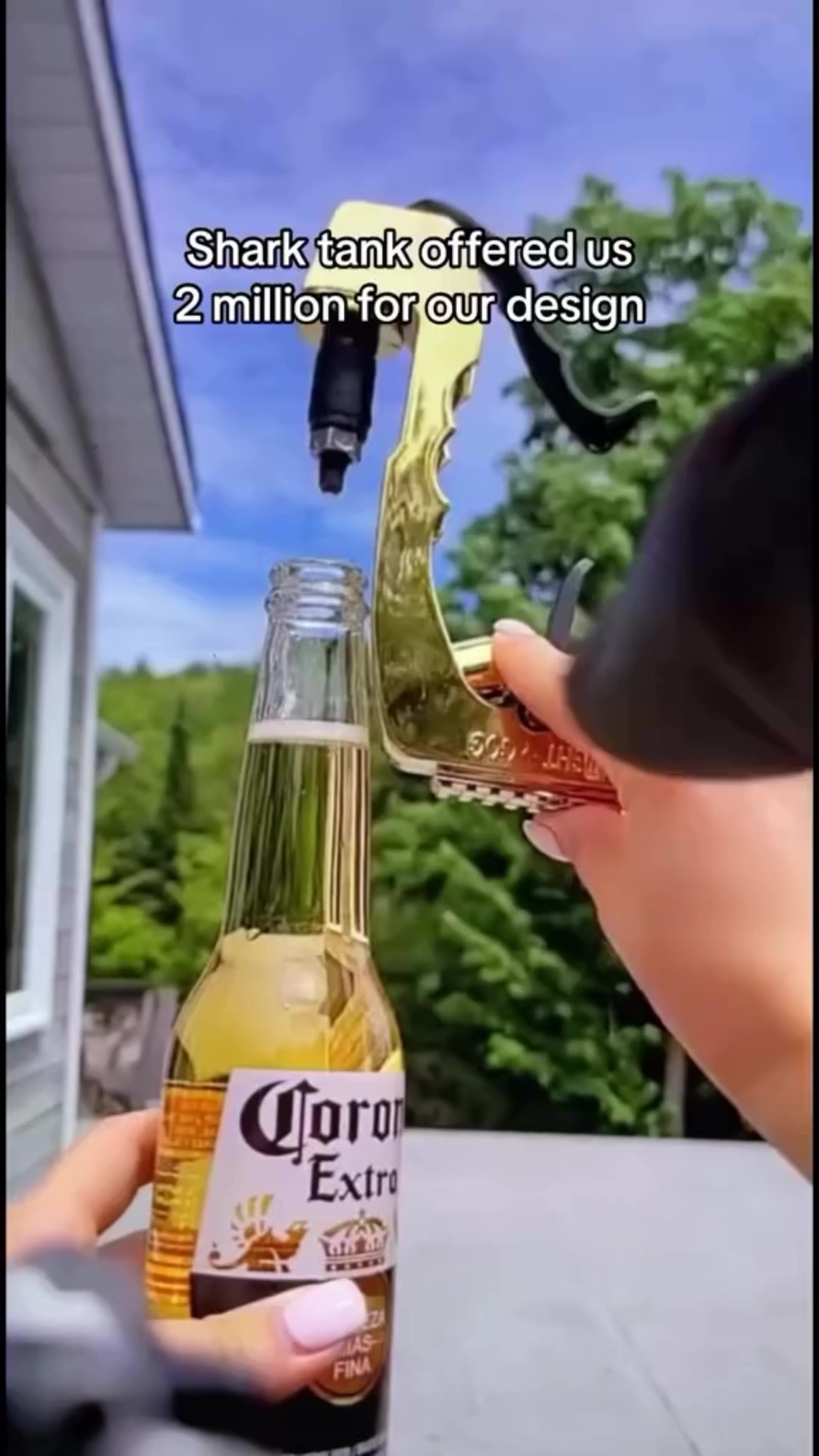 The cover photo shows a hand holding a golden tool over a Corona Extra beer bottle. The background includes green foliage and a blue sky. The text overlay states 'Shark tank offered us 2 million for our design'.