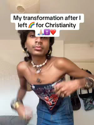 A person with dark hair, wearing a bandeau top and jeans, is positioned in front of a cream-colored wall. A text overlay at the top reads 'My transformation after I left for Christianity' with emojis representing a rainbow, praying hands, cross, and heart. The person wears large hoop earrings, a necklace, and bracelets. The image suggests personal transformation and religious conversion.