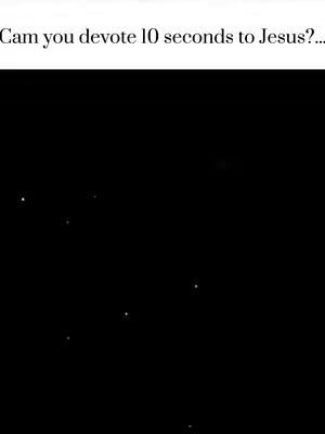 Black background with several small, bright white dots scattered across the frame. The dots appear to be randomly placed, with no discernible pattern visible.