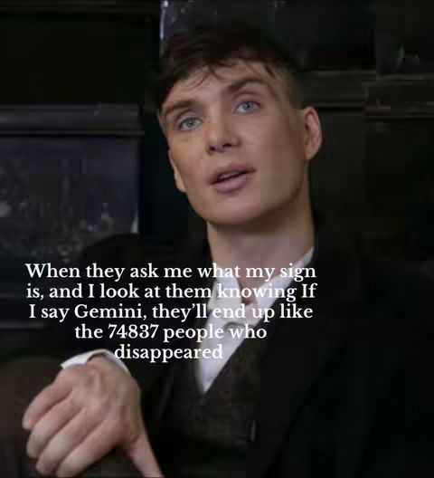 The image features actor Cillian Murphy, gazing directly toward the viewer in a medium shot. Text overlay indicates that the video likely deals with zodiac signs. The background is softly lit; the scene appears to be taking place indoors, with the actor wearing a dark suit.
