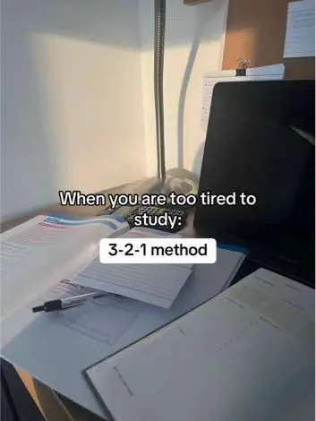 The cover image shows a well-lit desk with study materials. There are open books and papers, a laptop, a pen, and a small keyboard. The background is a plain wall. Text overlays on the image.