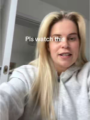 The cover image is a selfie featuring a young woman with long blonde hair, wearing a gray hoodie. The background is out of focus, suggesting an indoor setting like a home. Overlay text 'Pls watch this' is placed near the center