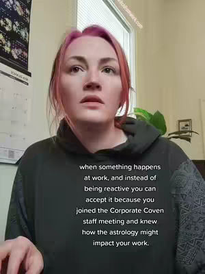 A woman with pink-dyed hair gazes upward with a concerned expression. Text overlays detail the video's topic. The setting appears to be an office or a home office with a window in the background and a calendar on the wall.