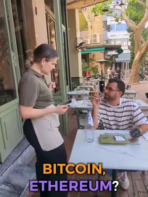 A woman in a server uniform is talking to a customer outside of a building. The customer is sitting at a table and holding food. Overlay text asks "BITCOIN, ETHEREUM?"