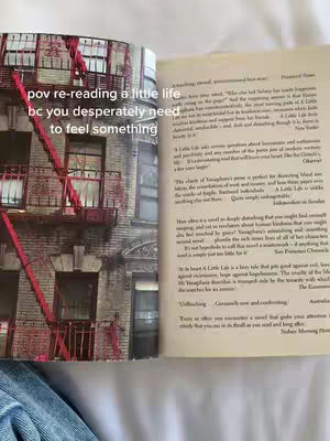The cover image shows an open book with a city scene visible on the left page and the text on the right page. Text overlays appear on the image.