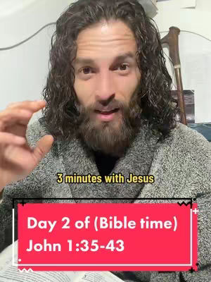 A man with curly hair and a beard is centered in the frame, speaking to the camera. He's wearing a gray robe. Text overlays include the video title and the main message, set on a background with red, black and white elements.