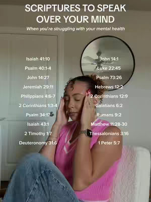A woman with curly hair is shown indoors, likely in a home setting. She is wearing a pink top and holding her temples with both hands, with her eyes closed, portraying a thoughtful or stressed expression. The background includes a doorway, a round mirror, and scriptural text overlaid on the image. The image is well-lit, with the woman centrally positioned and the text, along with bible verses, arranged around her.
