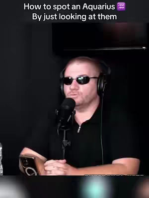 The cover image features a man wearing sunglasses and a headset, positioned in front of a microphone. Text overlays indicate a title related to astrology. The background is dark, providing a focus on the subject.