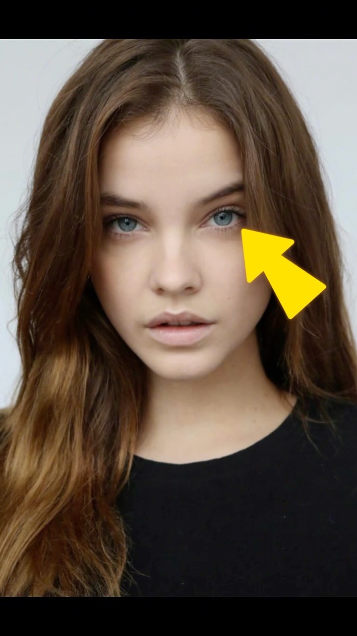 The cover image features a close-up of a woman's face, with her eyes as the focal point. A yellow arrow indicates one of her blue eyes. She has light skin and light brown wavy hair that frames her face.