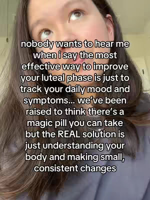 A selfie-style shot featuring a woman looking upward with text overlayed. The woman has long dark hair and is positioned in front of a blurred background. The text is centered and white, contrasting against the woman's appearance and the softer background.
