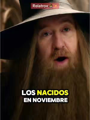 The cover image features a man with long, white hair and a beard, reminiscent of a wizard, wearing a large hat. Text overlays indicate the video is about astrology, the zodiac, and Scorpios.