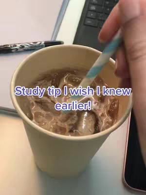 A close up shot of a cup with ice, an iced beverage and a hand stirring the drink with a straw. There is text in a blue font that reads: Study tip I wish I knew earlier!
