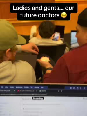 The cover image shows a classroom setting with several people. The main focus includes students, some on their phones, and a laptop screen visible. The overall composition gives off a candid vibe, typical of behind-the-scenes content. There are text overlays added as well.