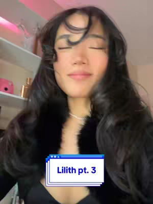 A woman with long, dark, wavy hair and closed eyes poses in front of a blurred background. A text overlay at the bottom reads 'Lilith pt. 3' in a blue and white design.