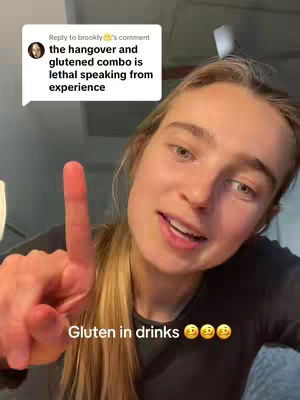 A woman with light skin and long blonde hair is pointing one finger up towards the top, her other hand is near her chest, her mouth open and talking. There is text overlaid on the image.