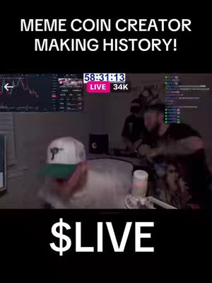 The cover image features a live stream with a man in a baseball cap and white hoodie in the foreground, looking at a computer screen displaying what looks to be a crypto price chart. Behind him are two more men and a bunch of computer equipment. Text overlays say "MEME COIN CREATOR MAKING HISTORY!" and \$LIVE. The background is blurred and dark. The timer in the screen says "58:31:13", and the live viewers are at 34K.
