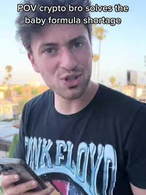 The cover image shows a man holding a phone talking to the camera. He wears a black t-shirt with the Pink Floyd logo. The background has greenery, other buildings, and a bright sky.