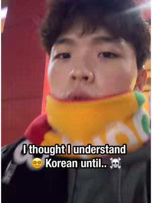 A close-up shot of a young man's face, with a yellow and red scarf around his neck. Text overlays add context to the image.