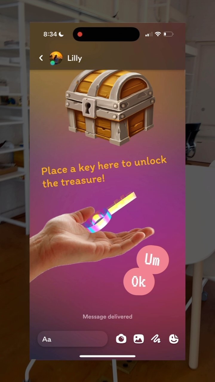 The cover image displays a mobile phone screen. It shows an in-app chat interface with a treasure chest icon at the top, a hand holding a colorful key. The text says “Place a key here to unlock the treasure!” Below the hand, two bubble icons labeled “Um” and “Ok”. The bottom has the “Message delivered” text. The background combines purple and orange gradient colors.